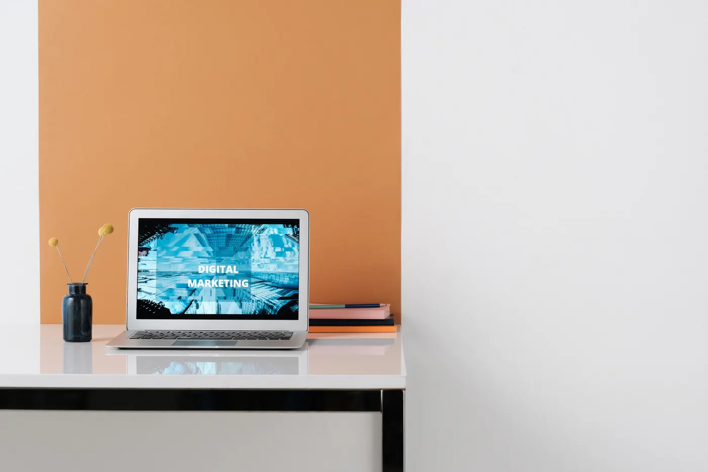 Real marketing design workspace showing a laptop-based creative production workflow