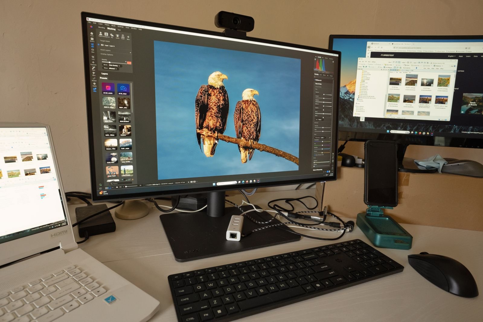 Real multi-monitor creative workspace for reviewing and refining AI-generated visual concepts